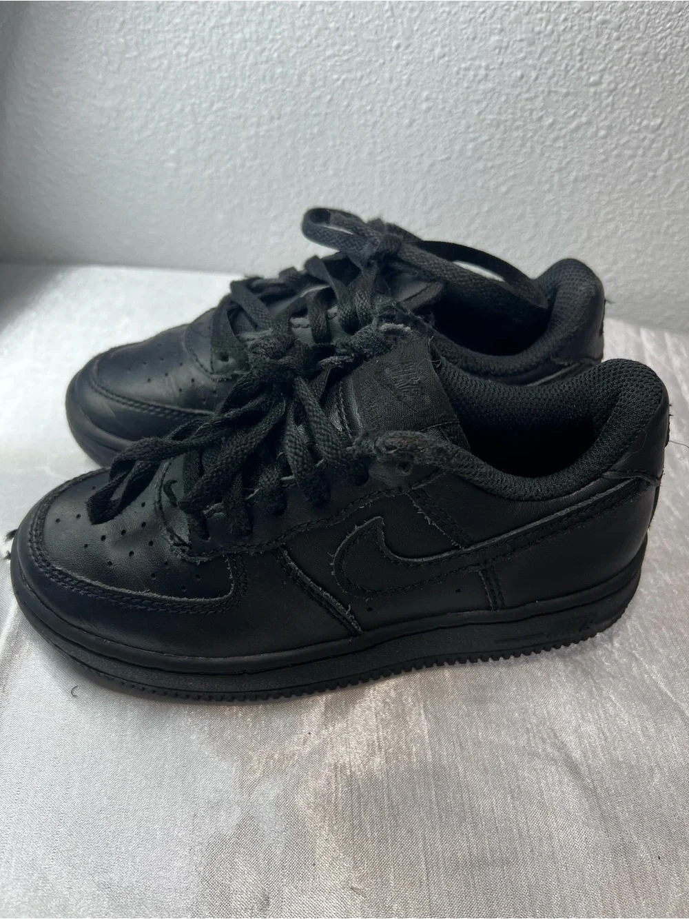 Nike Kids All-Black Leather Sneakers